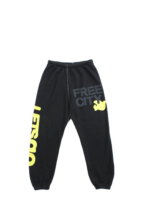 Unisex sweatpant with classic "Free City" print in black and yellow. A supersoft essential sweatpant with a covered elastic waist and a pull drawstring. WHY WE LOVE IT FREECITY, born in 2001, uses local factories with custom developed materials, fabrications, washes and dyes. Prints are hand-thrown, using hand-mixed paint with on-screen mixed gradients - made one by one, in small batches. DETAILS Medium weight polyblend: 50& rayon, 25% polyester, 25% cotton. Hand-sewn, washed, and hand-screen pr Freecity Sweatpants, Free City Sweatpants, Sweatpants Design, Pants Ideas, Graphic Sweatpants, Dream List, Real Christmas, Merch Ideas, Free City