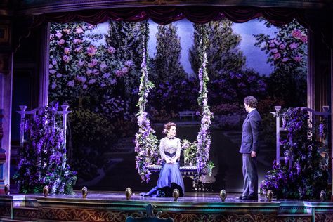 A Gentleman's Guide to Love and Murder. Walter Kerr Theatre (Broadway) Set design by Alexander Dodge. The main element to this design would be texture. The textures of the flowers are what pops out to me. The central focus is on the swing that is covered in flowers. The cool colors of purple and blue makes this garden feels welcoming and peaceful. Garden Stage Design, Insect Play, Cabaret Stage, Garden Stage, Set Theatre, Anastasia Musical, Gentlemans Guide, Theatre Scene, Stage Designer