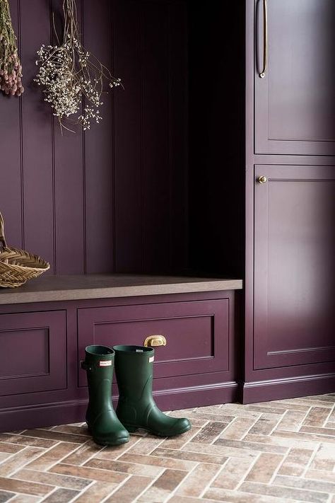 Purple mudroom with brick herringbone pavers features purple cabinets with brass pulls and a purple bench with purple stone top. Brick Herringbone Floor, Whittney Parkinson Design, Whittney Parkinson, Herringbone Brick Floor, Purple Cabinets, Transitional Laundry Room, Gold Light Fixture, Tudor Style Homes, Mudroom Design