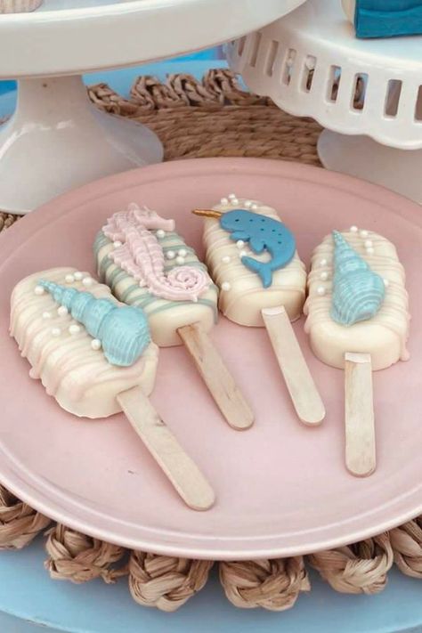 Take a look at this gorgeous under the sea birthday party! What cute cakecicles!! See more party ideas and share yours at CatchMyParty.com Cake Pops Under The Sea, Sea Animal Cake Pops, Ocean Theme Cake Pops, Under The Sea Marshmallow Pops, Under The Sea Birthday Giveaway, Sea Party Ideas, Wedding Cake Pops, Birthday Cake Pops, Baby Shower Cake Pops