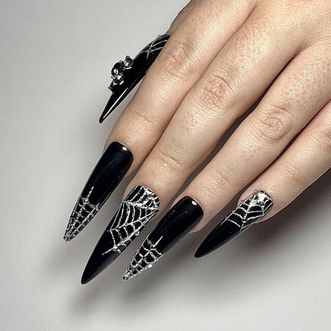 it’s the season of the witch, bitch 🖤✨ halloween is fast approaching which means i’ve got halloween nails on the brain! 🎃💅🏻✨ starting off with these perfectly witchy black extra long stiletto nails with sparkling spider web nail art, and get into that spider charm on the thumb! perfect for ANY halloween costume 🕷️🕸️✨ get your halloween press on nail orders in soon because spooky szn will sneak up on us this year! this set is available via my etsy store (link in bio 🔗) and can be recreat... Stilleto Spooky Nails, Cute Witchy Nails, Spider Web Nail Art, Web Nail Art, The Season Of The Witch, Witchy Nails, Long Stiletto Nails, Halloween Press On Nails, Long Stiletto