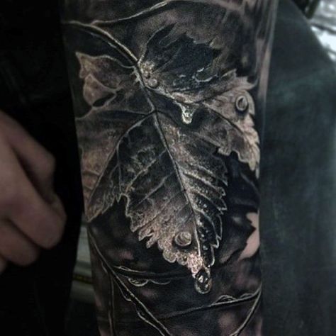 Brilliant Grey Colored Leaf And Dew Drop Realism Tattoo Mens Sleeve Blatt Tattoos, Natur Tattoo Arm, Nature Tattoo Sleeve, Autumn Tattoo, Leaf Tattoo, Full Sleeve Tattoo Design, Omerta Tattoo, Vine Tattoos, Incredible Tattoos