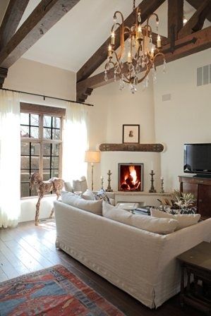 Light and beautiful Corner Kiva Fireplace Living Rooms, Corner Fireplace Styling, Spanish Corner Fireplace, Kiva Fireplace Living Rooms, Corner Chimney Living Room, Awkward Fireplace, Santa Fe Living Room, Santa Fe Interior Design, Sofa Lighting