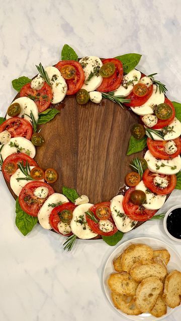 Maegan Brown ~ The BakerMama on Instagram: "Y’all love my Candy Cane Caprese Board so much, here’s the wreath version 😍😋 So easy and elegant ❤️🤍💚 Comment “BOARD” and I’ll DM you a 20% off promo code to shop my @boardsbythebakermama boards and the link to the full caprese how-to! or click the link in my profile for the recipe 🤗 Enjoy! #TheBakerMama #BoardsByTheBakerMama https://thebakermama.com/recipes/caprese-wreath/ #caprese #capresewreath #wreath #christmasappetizer #holidayappetizer #cheeseboard #cheeseplatter #christmascaprese #christmas #christmasfood #christmasrecipe #christmasideas #merrychristmas #christmassnack" Caprese Board, Whipped Cheese, Caprese Salad Appetizer, Bagel Crisps, Christmas Dinner Decorations, Christmas Party Snacks, Christmas Appetizers Easy, Smoked Salmon Bagel, Christmas Cheese