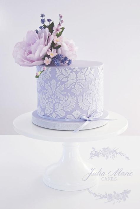 Lilac Floral Cake  with damask stencilling and decorated with whimsical sugar flowers - Cake by Julia Marie Cakes Birthday Cake Lilac, Lavender Colour Cake, Lavender Wedding Cake, Heart Birthday Cake, Julia Marie, Painted Wedding Cake, Sugar Flowers Cake, Lavender Cake, Heart Birthday