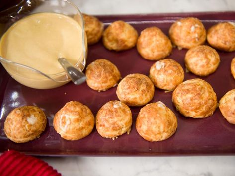 Gougeres with Gruyere Mornay and Beer Mustard Recipe | Geoffrey Zakarian | Food Network Beer Mustard Recipe, Gougeres Recipe, Beer Mustard, Beer Sauce, Geoffrey Zakarian, Mustard Recipe, Holiday Appetizers Recipes, Holiday Appetizers, Silicone Baking