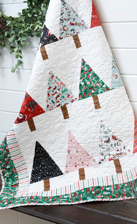 Try this Easy Beginner Friendly Winter Pines Quilt Tutorial! This quilt is mighty pine! Piece a beginner-friendly Winter Pines Quilt using the Missouri Star pattern and cheery Twas fabrics by Riley Blake designer Jill Howarth. Modern Christmas Tree Quilt Pattern, Winter Pines Quilt Pattern, All Wrapped Up Quilt Pattern Free, Quilting Projects Christmas, Fat Quarter Christmas Quilts, Christmas Quilt Fabric, Free Christmas Tree Quilt Pattern, Christmas Tree Quilt Patterns Free Printable, Christmas Quilt Patterns Easy