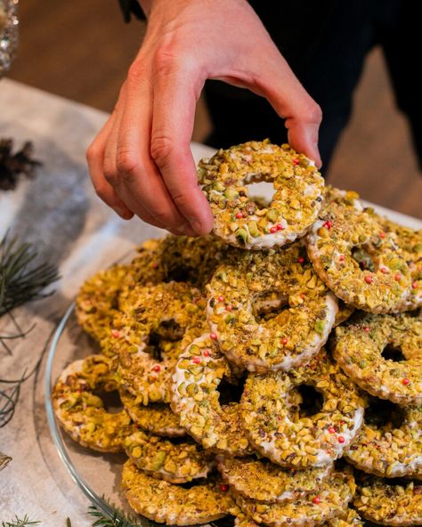 Pistachio Wreath Cookies - Table Magazine Pistachio Cookies Recipe, Wine Ingredients, Wreath Cookies, Pistachio Cookies, Cookie Table, Brunch Cocktails, Beer Cocktails, Cocktail Desserts, Winter Drinks