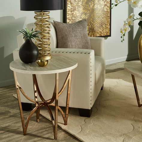 Sure to be the center of attention of any room, the Vittoria champagne gold finish end table displays impressive style and design. Taupe And Gold Living Room, Gold End Tables Living Rooms, Table Between Two Chairs Living Rooms, Living Room End Table Decor Ideas, Living Room End Table Ideas, Living Room Side Table Ideas, End Table Styling, Cream And Gold Living Room, Gold End Tables