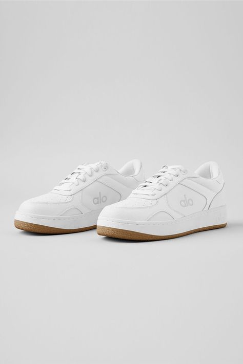 Meet the Alo Recovery Mode Sneaker: The first shoe that’s engineered for performance recovery and designed for a clean, modern, streetwear look. It has a structured, supportive outer sole and a high-rebound foam insole to support balance and pressure points for all-day recovery. Made from cruelty-free vegan leather and recycled components, the revolutionary tech and abrasion-tested rubber ensure that it lasts three times longer than any other street shoe on the market. Bottom line: the Alo Recov Honeymoon Fits, Womens Onesie, Modern Streetwear, Street Shoes, Candles For Sale, Tank Top Bras, Womens Capris, Pressure Points, Clean Modern