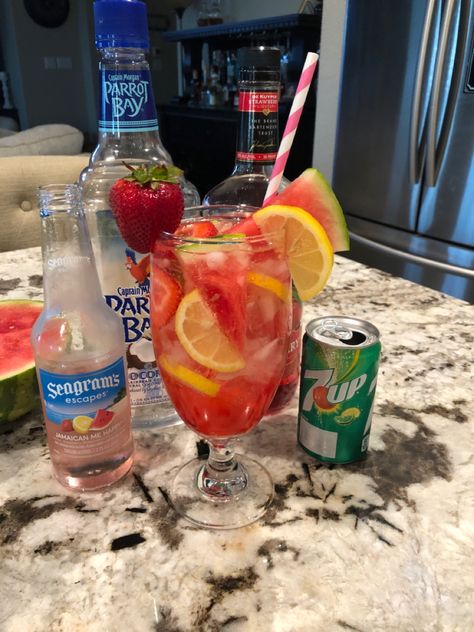 1 oz. Coconut Rum, 1 oz. Strawberry Pucker, 4 oz. Seagrams Jamaican me happy, fill rest with 7up. Strawberry, lemon and watermelon slices. Seagrams Jamaican Me Happy, Seagrams 7 Recipes, Seagrams Drinks, Seagrams 7, Liquor Recipes, Mixed Drinks Alcohol, Yummy Alcoholic Drinks, Alcohol Party, Diy Drinks