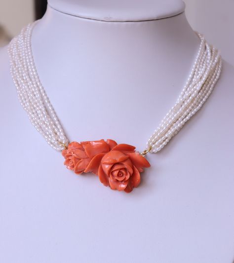 Antique Vintage Carved Coral Rose Collier Necklace Pendant Momo Coral This is vintage carved coral flowers from natural Japanese momo coral assembled with original seed pearls, rice pearls, multi strand. The necklace is decorated also by antique carved coral clasp made from gold 9k (tested by acid). There is also initials on the back side of clasp. Very beautiful detailed carving of flowers! And large size! This collier looks really gorgeous. Dimensions of coral roses: 5,5cm x 3cm / 2,2 x 1,2in Carved Coral Jewelry, Coral Rose Jewellery, Coral Necklace Designs, White Coral Necklace, Coral Jewelry Vintage, Coral Jewellery, Coral Jewelry Set, Coral Roses, Rice Pearls