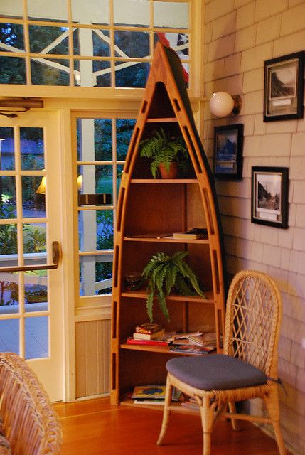 Canoe bookshelf by afagen, via Flickr Canoe Bookcase, Canoe Bookshelf, Canoe Shelves, Boat Bookshelf, Canoe Shelf, Boat Bookcase, Family Lake House, Cheap Dresser, Log Home Kitchens