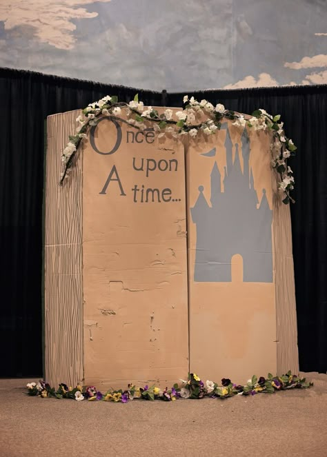 Disney once upon a time book. Decorations. Photo booth Disney Party Photo Backdrop, Disney Backdrop Photo Booths, Disney Homecoming Decorations, Shrek Photo Booth, Disney Homecoming, Graduation Books, Once Upon A Time Wedding, Once Upon A Time Book, Book Decorations