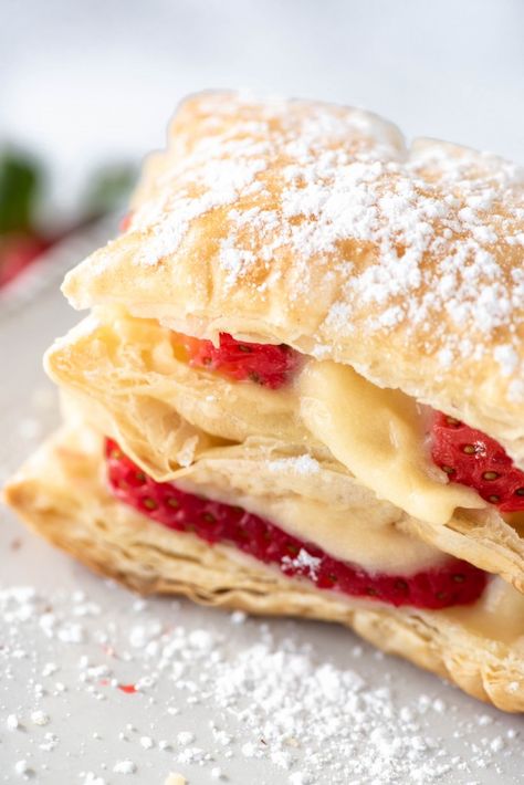 This Strawberry Napoleon dessert (also known as mille feuille) is a simple French dessert using puff pastry. With delicate layers of custard, strawberries and puff pastry, it's the best napoleon dessert recipe! Strawberry Napoleon, Recipe With Puff Pastry, Zabaglione Recipe, Napoleon Pastry, Napoleon Dessert, Switchel Recipe, Puff Pastry Cake, Using Puff Pastry, Rumchata Recipes