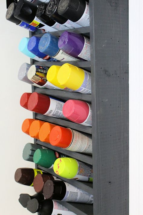 We had a bunch of spray paint cans in our garage and needed a good place to store them. So I built this awesome wall mounted paint can holder. It can hold up to 50 cans, which should be great for most workshops. #paint #garage #organize #diy #workshop #make #build Paint Storage Diy, Spray Paint Storage, Storage Furniture Design, Craft Paint Storage, Paint Rack, Diy Spray Paint, Garage Tool Storage, Garage Organization Diy, Garage Organize