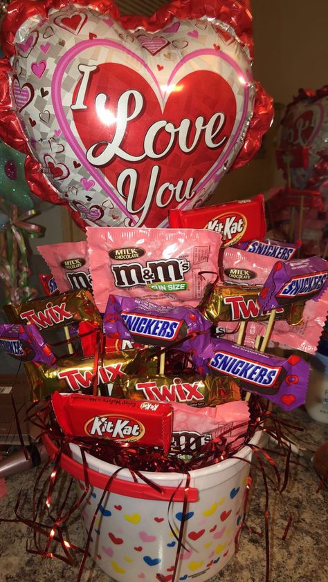 Candy (snickers, Kit Kat, Twix, m&ms), heart shaped bucket, balloon Mens Valentines Day Gifts Basket, Valentines Candy Gifts, Mens Valentines Day, Mens Valentines Day Gifts, Valentines Candy, Valentines Day Baskets, Gift Baskets For Him, Valentine Gift Baskets, Valentine Baskets