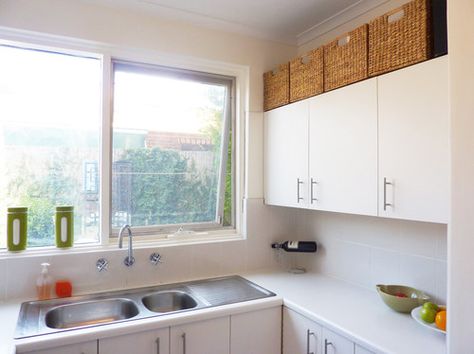 Fill wasted space above upper kitchen cabinets with attractive woven storage baskets. Baskets Above Kitchen Cabinets, Ikea Baskets, Kitchen Wishlist, Space Above Kitchen Cabinets, Visual Clutter, Wooden Kitchen Cabinets, Upper Kitchen Cabinets, Kitchen Banquette, Above Kitchen Cabinets