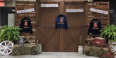 We made this backdrop for the Union County FFA Banquet.  We used two barn doors made by my husband and stacked pallets together. Ffa Backdrop, Ffa Banquet Ideas, Ffa Banquet Decorations, Stall Decorations, Ag Teacher, Barn Stalls, Union County, Banquet Decorations, Ffa