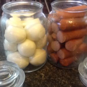 Pickled Eggs and Pickled Wieners made with white vinegar and pickling spice, onions and celery to help infuse the flavours. Sweet And Spicy Pickled Eggs, Pickled Wieners Recipe, Diy Pickles, Pickled Sausage, Pickled Eggs Recipe, Pickled Foods, Newfoundland Recipes, Pickle Vodka, Preserving Foods