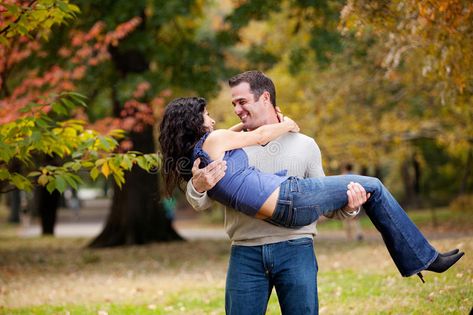 Woman in Man s Arms. A man holding a woman in his arms in the park #Sponsored , #Advertisement, #AD, #Man, #man, #arms, #Arms Man Holding Woman, Man Carrying Woman, Man Hug, Woman Stock Photo, In His Arms, Couple Holding Hands, Hugging Couple, St Patrick Day Shirts, Japanese Men