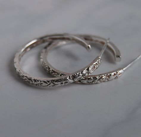 "Hoop Earrings, Sterling silver 3 different sizes, Floral design in a narrow width.  These are carved by me and I also do this in a wider band available in gold or silver. Sizes 1\", 3/4\" and 1/2\" Width 2.5mm Solid Sterling silver Copyright Lstellajewelry 2023" Silver Floral Hoop Earrings, Earrings Aesthetic Silver, Hoop Earrings Aesthetic, Sliver Earrings, Vintage Silver Earrings, Earrings Aesthetic, Hoop Earrings Silver, Indian Jewelry Sets, Jewelry Lookbook