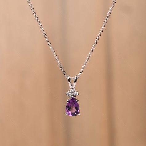 It is a natural amethyst pendant, pear cut, measures 9x6 mm,about 1.34 carats The basic metal is sterling silver and plated with rhodium. To change the metal to a solid gold (white/rose) or platinum is also available, please ask for a quotation if you want. You can also go to my shop Home for more elegant rings:  https://www.etsy.com/shop/godjewelry?ref=hdr_shop_menu Amethyst is birthstone of February More alexandrite rings: https://www.etsy.com/shop/godjewelry?ref=seller-platform-mcnav&section_