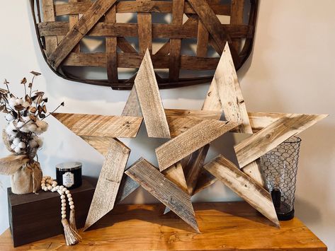 Add a rustic touch to your home with our 30-inch wooden star, crafted from beautifully distressed wood. Whether you prefer is stained for a rich, warm finish or left natural for a more rustic look, this star is a perfect statement piece for any space. Hang it indoors or out for a charming, farmhouse-inspired accent!  Note: This item can be customized with laser engravings. The engravings will be placed on the arms of the star, allowing you to add a personal touch to this beautiful piece. Rustic Wood Star, Wood Stars Diy Rustic, Wooden Christmas Stars Diy Wood, Christmas Decor Wood Diy, Wood Stars Diy Rustic Christmas Decor, Wood Holiday Decor, Scrap Wood Ornaments, Woodworking Decorations, 4x4 Wood Projects