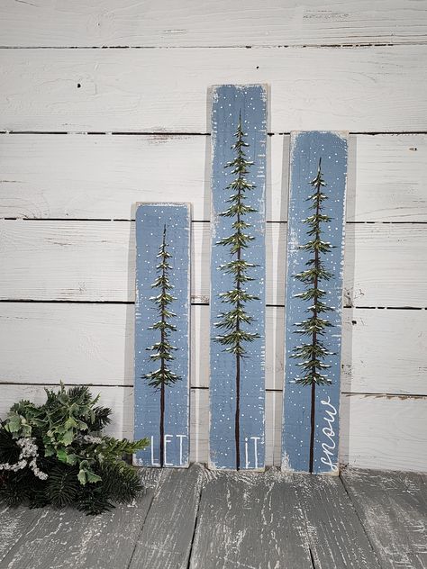 Original Acrylic painting on reclaimed Pallet boards. These unique pieces are 24", 21", 17" Tall by 3 1/2 wide This 3 piece set of snow covered pine Christmas trees is a great Christmas decoration that can be used all Winter long!  The trees and the saying "let it snow" are hand painted on reclaimed pallet wood that is painted with layers of white and gray-blue that is sanded for an aged look.  **Let me know if you have a color request** All of my creations are made of reclaimed boards. They are hand painted and are made after they are ordered.  Although I try to duplicate original as closely as possible, there may be slight variations because no two boards are identical. Creations may vary in size by 1/2" to 1" either way.  Painted and shipped in 7-10 days. Signed by artist. Please contac Let It Snow Painting, Christmas Shelf Sitters, Snow Covered Pine Trees, Pine Trees Christmas, Christmas Tree Sign, Snow Painting, Christmas Shelf, Tree Sign, Pine Christmas Tree