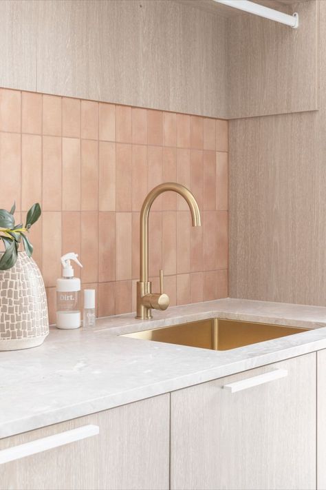 The laundry features terracotta velvet tiling and brushed brass tapware. Mediterranean Laundry, Brass Tapware Bathroom, Modern Mediterranean Bathroom, Modern Mediterranean Interior Design, Treehouse Inspiration, Brushed Brass Tapware, Brass Tapware, Abi Interiors, Laundry Room Tile