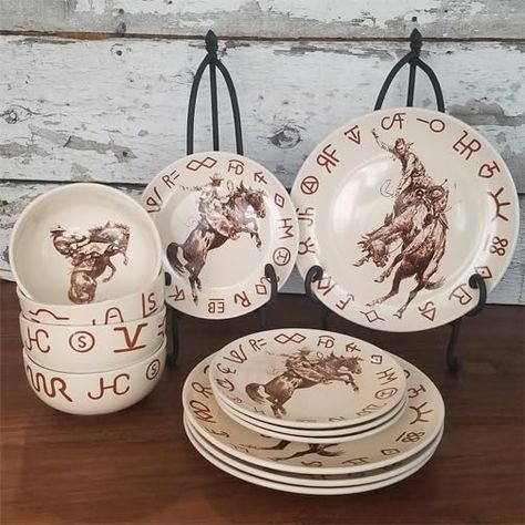 PRICES MAY VARY. Western Cowboy Dinnerware Set with Ranch Brands and Classic Western Images of Bucking Broncs Broncs & Brands 12 Piece Dinnerware Set by Cowboy Living -- Inspired by the artwork of the American West. This is restaurant quality durable porcelain that is dishwasher and microwave safe. The base color is cream. This set includes four 11 inch dinner plates, four 8-1/2 inch side plates, and four 28 ounce dinner bowls. Western Dinnerware Sets, Western Plates Dinnerware Sets, Western Dishes Sets, Cowboy Kitchen Decor, Western Plates, Ranch Glam, Cowboy Kitchen, Real Farmhouse, Brown Kitchen Decor