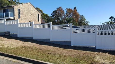 Did you know? PVC fences aren't just for the ground - we can attach them to concrete sleeper retaining walls too! Our specially designed aluminium inserts allow us to attach them to sharkfin brackets to ensure they maintain their strength and durability. Plus, we can customize the fence for step-downs on sloped properties! Just like Troy, Matt, Sandra, Kevin, and many others have done already, get in touch with us today to see how we can meet your retaining wall fencing needs. #Hartbuil... Fence On Slope, Concrete Sleeper Retaining Walls, Concrete Fence Wall, Sleeper Retaining Wall, Concrete Sleepers, Fence Wall Design, Pvc Fence, Fence Wall, Concrete Fence