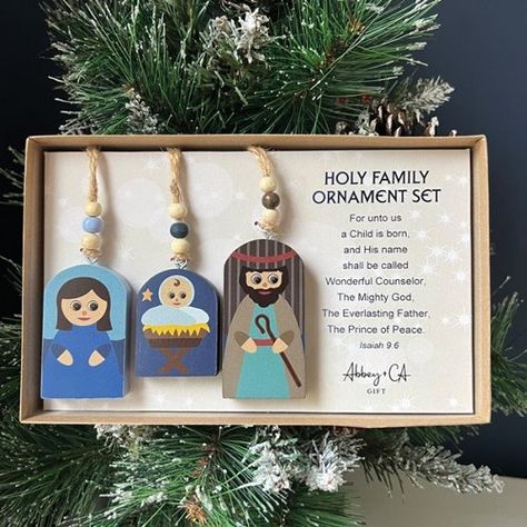 Three piece holy family ornament setColorful MDF ornaments, sublimated on front and back with hand painted edgesIncludes Mary, Joseph, and baby Jesus Each includes wood beads and jute hangerSizes range from 2 x 3, all are 0.5 thickGift boxed with Scripture verseFor unto us a Child is born, and His name shall be called Wonderful Counselor, The Mighty God, The Everlasting Father, The Prince of Peace. Isaiah 9:6 Mary Joseph And Baby Jesus, Isaiah 9 6, Isaiah 9, Wonderful Counselor, Nativity Ornaments, Christmas Crafting, Prince Of Peace, A Child Is Born, Preschool Lessons