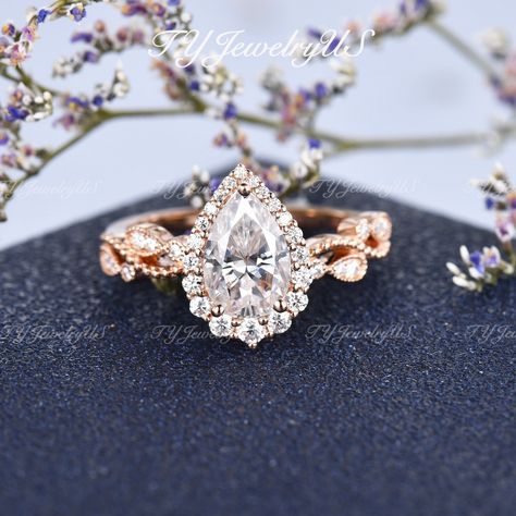 1.6ct Pear Shaped Moissanite Engagement Ring Set Diamond Halo Ring Woman Rose Gold Vine Flower Milgrain Ring Half Eternity Anniversary Gift Items Description: * Handmade, high-quality item! * Material: SOLID 14K/18K GOLD (can be made in white/rose/yellow gold) Engagement Ring: * Center stone: Moissanite, Pear Shaped 6*9mm, approx. 1.6 CT * Accents: Natural Diamonds, VS clarity, G color, 0.32ct Total Or Colorless Moissanites, DE color, VVS clarity Natural Fresh Water Pearl * Band width approx 2.2 Fav Products, Commitment Rings, Milgrain Ring, Moissanite Engagement Ring Set, Future Engagement Rings, Eye Makeup Designs, Diamond Halo Ring, Yellow Gold Engagement, Yellow Gold Engagement Rings