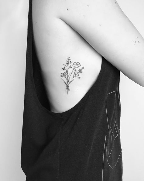 Small minimalist wildflower tattoo with fine black lines and detailing. Flower tattoo, black tattoo, feminine tattoo, floral tattoo Wildflowers Tattoo, Sunflower Tattoo Shoulder, Sunflower Tattoo Small, Permanente Make-up, Wildflower Tattoo, Muster Tattoos, Small Flower Tattoos, Tato Lengan, Sunflower Tattoos