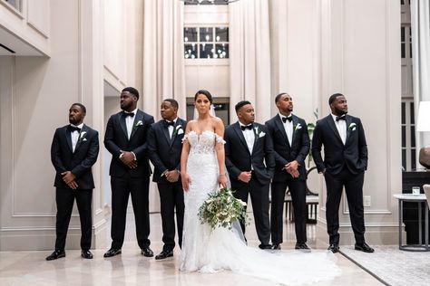 Brides don't typically request photos with the groomsmen but when they do its a perfect opportunity to make the bride stand out, looking even more like a superstar surrounded by bodyguards! Cute Groomsmen Pictures, Groomsmen With Bride Photos, Bridal Party Photos Black People, First Look Wedding Photos Groomsmen, Bride First Look With Groomsmen, Groom With Bridesmaids Pictures, Groomsmen First Look With Bride, Groomsmen With Bride, Bride And Groomsmen Pictures