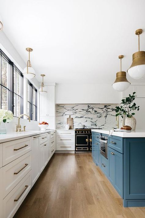 A stainless steel microwave is built in to a peacock blue kitchen island donning brass hardware and polished brass faucets fixed over a prep sink lit by Kelly Wearstler Precision Pendants. Reno Kitchen, Green Kitchens, Blue Kitchen Island, Kitchen Views, Blue Kitchen, Transitional Kitchen, Island Design, Kelly Wearstler, Blue Kitchens