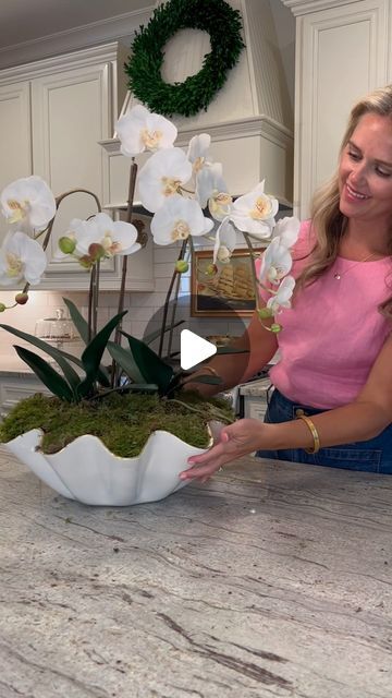 Whitney on Instagram: "I found this faux orchid at a yard sale and couldn’t wait to style it in my new @susangordonpottery wavy bowl! If you saw my previous post from this week, I ended up using this centerpiece on our dining room table.

#centerpiece #centerpiecesideas #centerpiecedecor #orchid #orchidarrangement #grandmillennialdecor #grandmillennialhome #homedecorideas #yardsalefinds #diyhomedecor #diyflowerarrangement" Orchid Centerpiece Diy, Faux Orchid Arrangements, Wavy Bowl, Dining Room Table Centerpiece, Faux Orchid, Grand Millennial Decor, Orchid Centerpieces, Yard Sale Finds, Orchid Arrangements