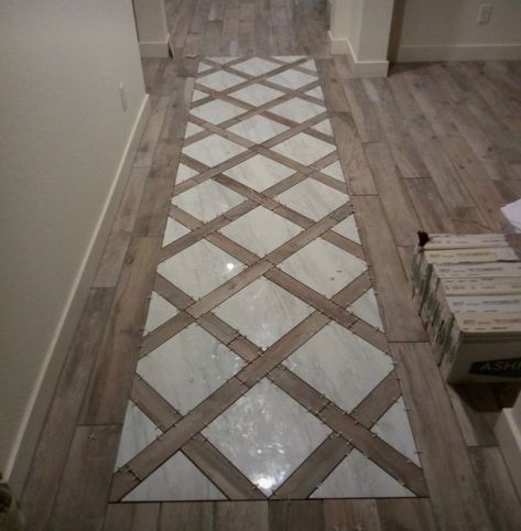 Tile That Looks Like A Rug, Tile By Front Door Entry Ways, Accent Floor Tile Bathroom, Closet Tile Flooring, Open Floor Living Room Ideas, Travertine And Wood Floors, Small Hallway Flooring Ideas, Cobblestone Flooring Interior, Tile Inlay Wood Floor Entryway