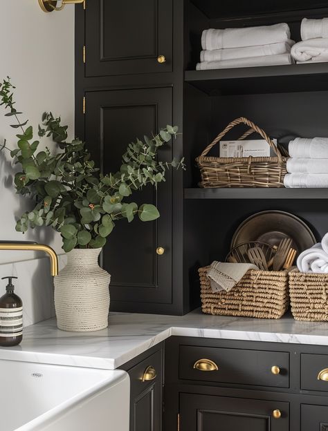 44 Super Chic Laundry Room Ideas 36 44 Super Chic Laundry Room Ideas Laundryroom Painted Cabinets, Laundry Room Styling Ideas, Laundry Room With Fridge Ideas, Black Washer Dryer Laundry Room, Black And Gold Laundry Room, Laundry Room Moody, Side By Side Laundry Room Ideas, Laundry Room Black Cabinets, Black Laundry Room Cabinets