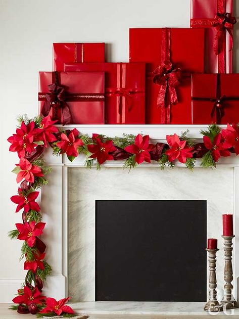 Fireplace Christmas decorating ideas don't get more wow-worthy than this rosy red display. Bold wrapped boxes top the mantel, while a stunning poinsettia garland wraps around the edge. #christmasmantel #christmasmantelideas #manteldecorations #garland #holidaydecor #bhg Room Theater, White Christmas Wreath, White Christmas Ornaments, Christmas Fireplace Decor, Christmas Mantel Decorations, Festival Diy, White Christmas Decor, Christmas Fireplace, Christmas Mantels