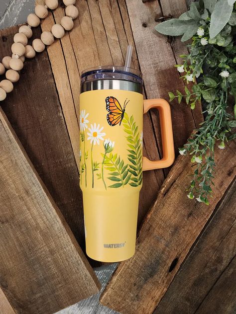 Get ready to elevate your sipping experience with this limited-edition collection!  Each 40oz tumbler with handle is a handpainted floral design that will make you stand out from the crowd.  Each cup is sanded, painted, and sealed with coats of matte spray.   "Fly High" is vinyl along bottom. This tumbler works great f Stanley Cup Painted, Painted Water Bottle Ideas, Painting Stanley Cups, Painted Cups Ideas, Hand Painted Tumblers, Painted Stanley Cup, Painted Water Bottle, Stanley Ideas, Remove Bleach Stains