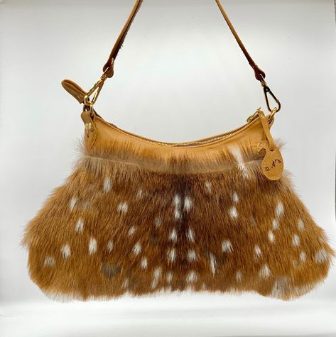 "Axis deer skin with fur and leather handbag is a perfect medium size bag for over the shoulder. The leather is a golden brown genuine cow leather in the back trim and handle. There is a brown suede side cowhide strip on strap to prevent the handle from slipping. The zipper is brass YKK, a magnetic pocket in the back and 2 pockets inside the cotton lining. The bag is 12\" at the top x14\" wide at the base 9\" top to bottom The handle is 20\" long" Axis Deer, Vintage Designer Bags, Cowhide Bag, Vintage Black Glamour, Medium Handbags, Latest Bags, Fur Bag, Deer Print, Tapestry Fabric