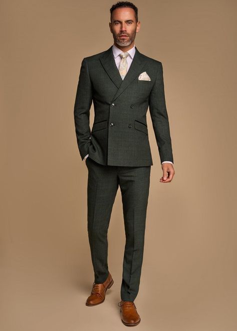 This elegant double breasted green olive 2 piece suit from Cavani is the height of sophistication. With peaked lapels and a double breasted blazer it's a shoe in for your suit collection FREE POSTAGE Slim fit Double breasted blazer Peaked lapels Double vent back 2 side pockets and inside pocket Trouser length is 32 in inside leg but can be shortened or lengthened Mix And Match Suits Men, Tuxedo Wedding Suit, Navy Suit Wedding, Green Wedding Suit, Mens Suede Boots, Blazer Wedding, Brown Shoes Men, Elegant Suit, Black Suit Wedding