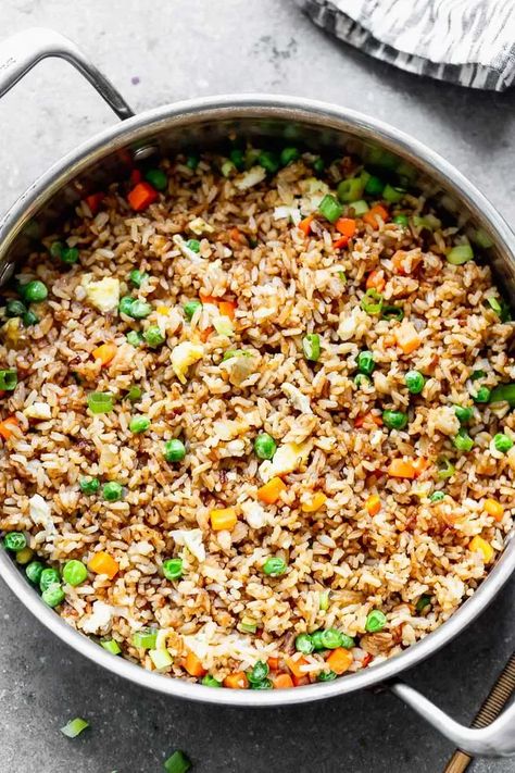 This Easy Fried Rice with Egg is SO good, and will quickly become your go-to recipe for fried rice! This simple version is packed with garlic, carrots, peas, and plenty of scrambled eggs. Easy Fried Rice With Egg, Recipe For Fried Rice, Special Fried Rice Recipe, Easy Egg Fried Rice, Rice With Egg, Fried Rice Seasoning, Breakfast Fried Rice, Garlic Carrots, Special Fried Rice