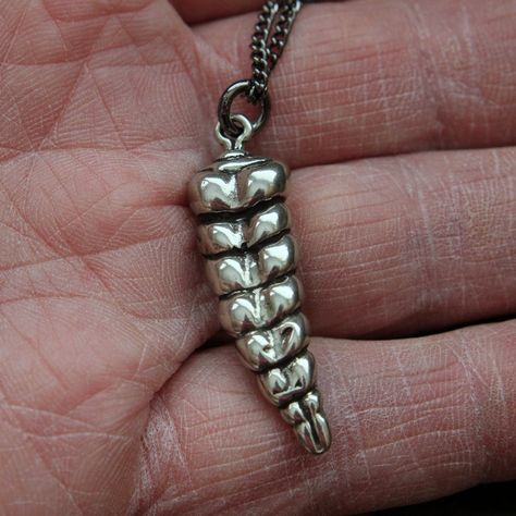 "This snake rattle pendant was cast directly from the tail of a real road killed Texas rattler.  Every tiny detail of the original has be immortalized in solid white bronze with a thick sterling silver overlay. There are eight perfectly formed segments or buttons on the 1-1/2\" rattle and if you listen real hard you can almost hear them vibrate.  Chain may be slightly different than pictured. This one would go great worn with a pair of my matching rattlesnake vertebrae earrings. http://www.etsy. Rattle Snake, Lover Necklace, Necklace Snake, Button Studs, Lovers Necklace, Fish Tail, Metal Art Projects, Handmade Necklace, Necklace Silver