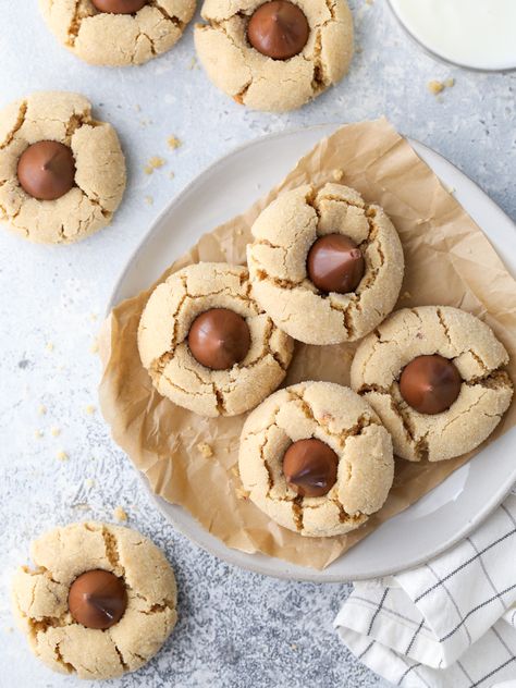 Classic Peanut Butter Blossom Cookies - Completely Delicious Peanut Blossom Cookies, Kiss Cookie Recipe, Peanut Butter Blossoms Recipe, Peanut Butter Kiss, Peanut Butter Blossom, Peanut Butter Kiss Cookies, Completely Delicious, Traditional Christmas Cookies, Soft Peanut Butter Cookies