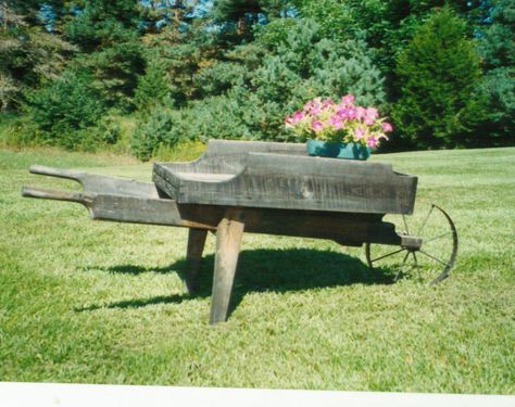 Metal Wheel Hardware | Flower Carts | Garden Carts | Wooden Wheelbarrow Wooden Wheelbarrow Planter Plans, Wooden Wheelbarrow Diy, Wooden Flower Cart Plans, Antique Wheelbarrow, Rustic Wheelbarrows, Flower Carts, Old Wooden Wheelbarrow, Medieval Wheelbarrow, Wooden Wheelbarrow