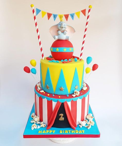 My most recent cake. Top tier is chocolate cake and bottom tier is vanilla cake. The ball on top is made from Rice krispie treats. Carnival Birthday Cakes, Dumbo Cake, Circus Birthday Cake, Dumbo Birthday Party, Circus First Birthday, Circus Theme Cakes, Circus Cakes, Circus 1st Birthdays, Carnival Cakes