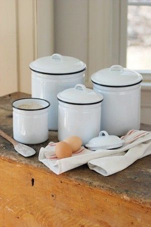 Simple white canisters with black rim Farmhouse Kitchen Canisters, Vintage Kitchen Canisters, Enamel Ware, Kitchen Canister Set, Vintage Canisters, Farm Kitchen, Vintage Enamelware, White Dishes, Kitchen Canisters